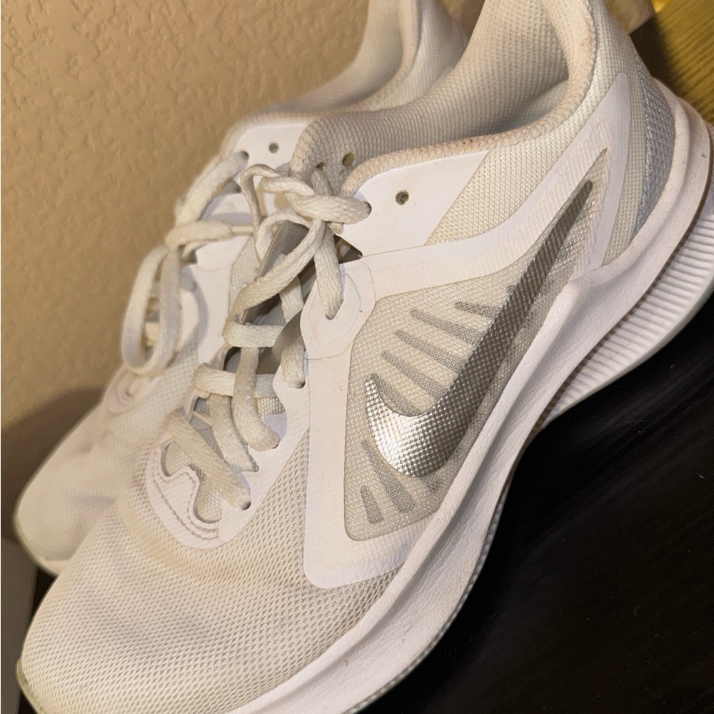 Nike Women's White Athletic Sneakers with Silver Swoosh Accent